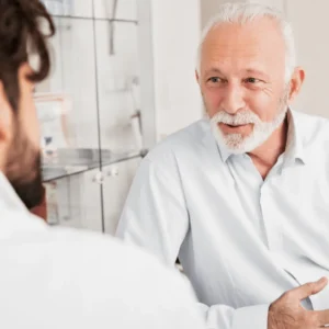 Smiling Senior Man Talking To Doctor in Lehi, UT | Avanti Medical Center