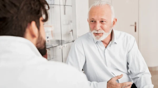 Smiling Senior Man Talking To Doctor in Lehi, UT | Avanti Medical Center