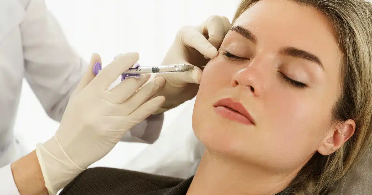 A injector is injecting radiesse filler to a women in Lehi, UT