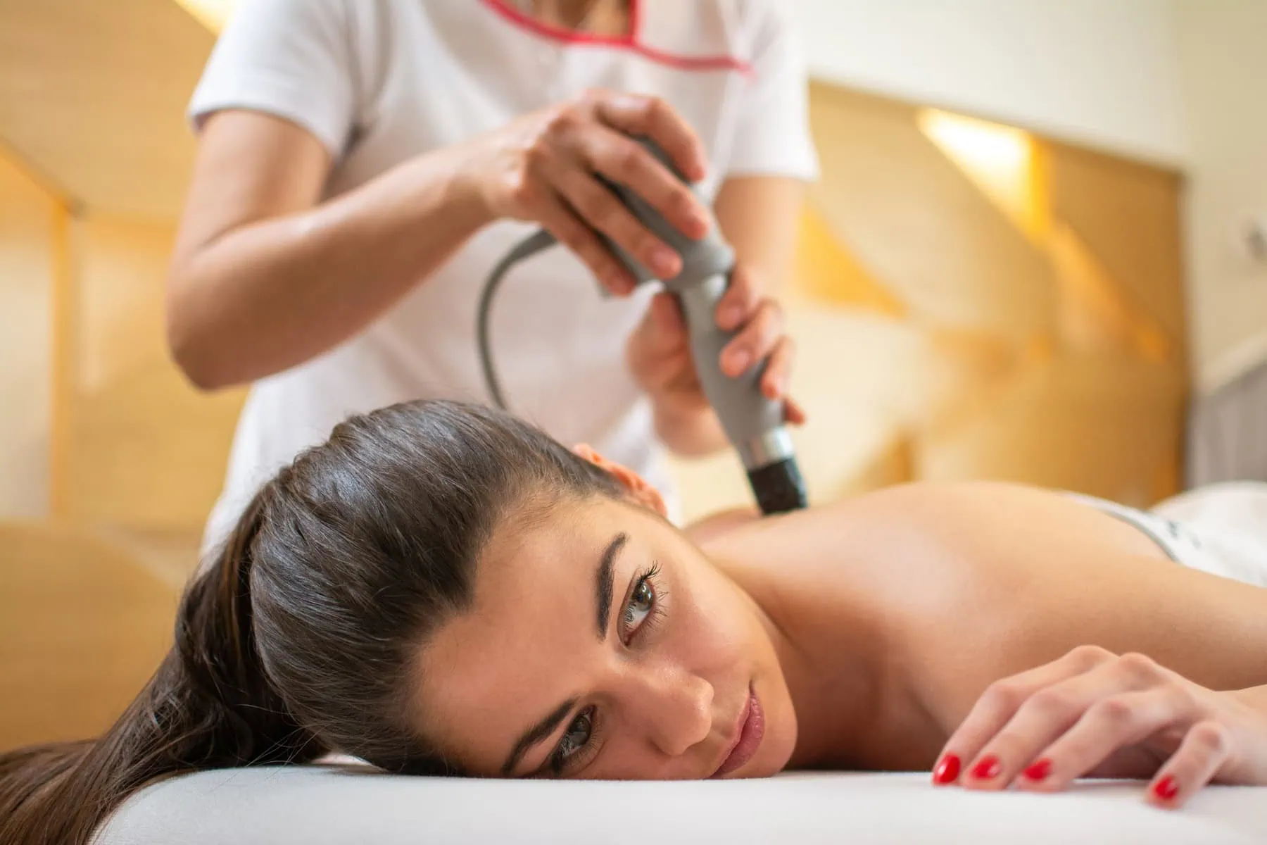 Woman Receiving Acoustic Sound Wave Therapy in Lehi, UT | Avanti Medical Center