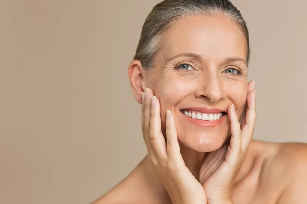 Smiling Mature Woman Touching Her Face in Lehi, UT | Avanti Medical Center