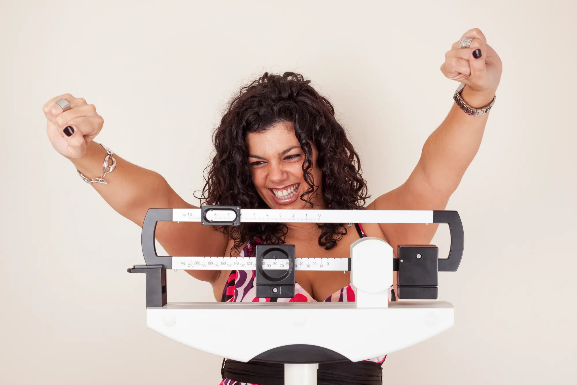 Woman Checking Weight On Scale in Lehi, UT | Avanti Medical Center